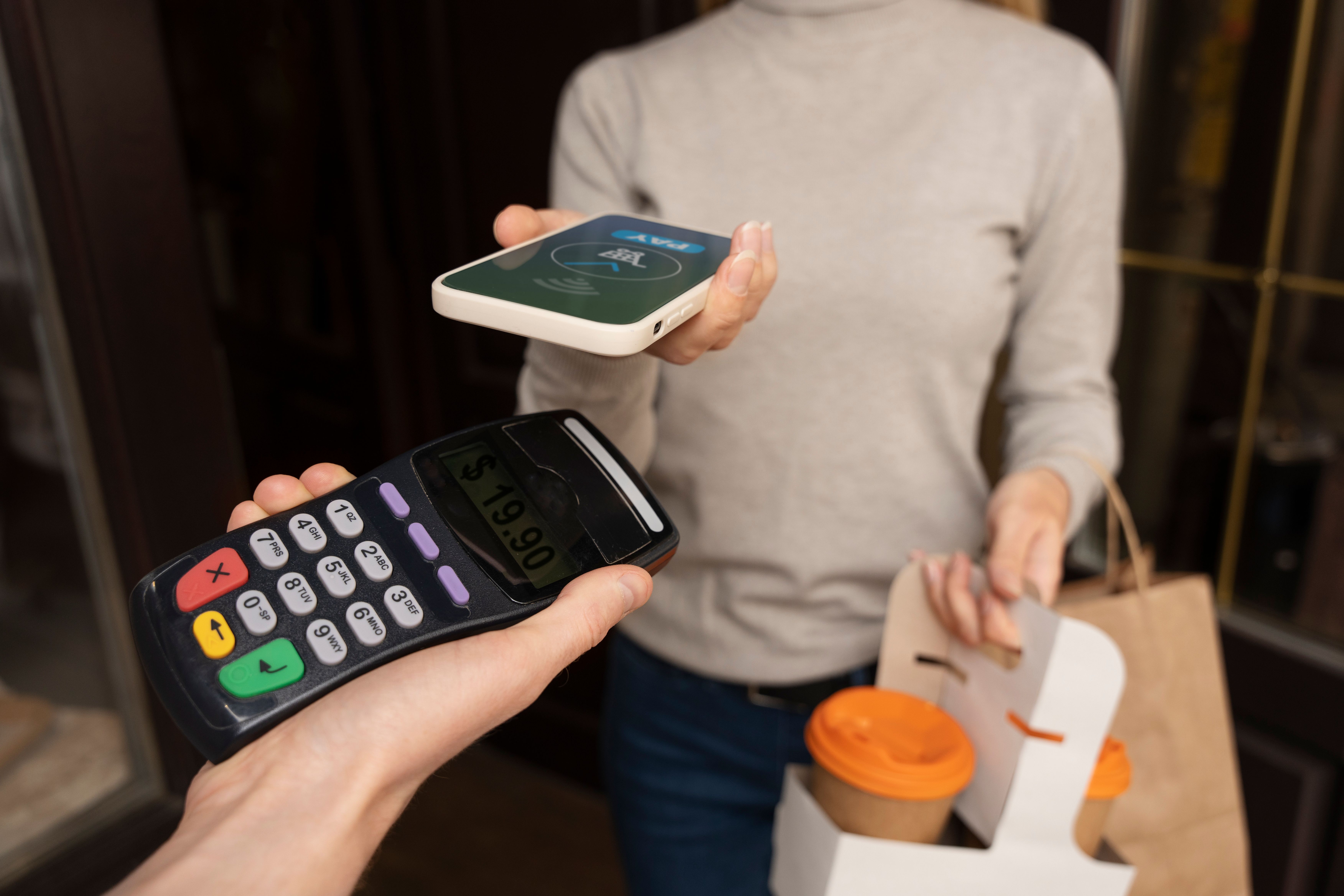 person-paying-using-nfc-technology (1).jpg